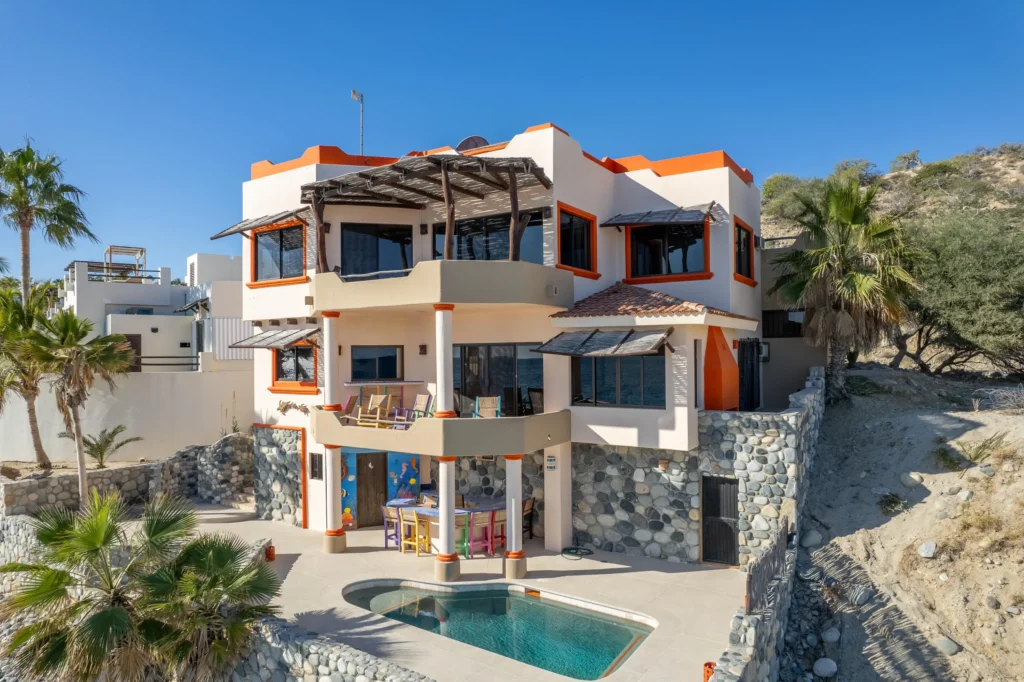 Modern homes in Cabo San Lucas for sale featuring sleek oceanfront coastal architecture