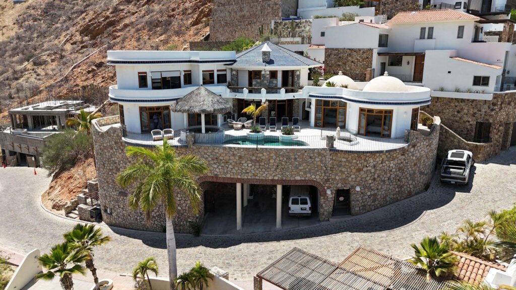 Cabo San Lucas Pedregal Csl Casa Agave presents a rare invitation to experience the raw beauty and vibrant life of the Pacific Ocean from a residence of contemporary distinction. Designed for those who seek both serene sanctuary and moments of shared delight, this seven-bedroom oceanfront home offers an unparalleled connection to the stunning Los Cabos coast.Imagine waking to the sound of waves, the horizon a canvas for breathtaking sunrises. At Casa Agave, the expansive living spaces seamlessly merge with the coastal landscape, offering uninterrupted – 175 Camino Grande, Cabo San Lucas, BS