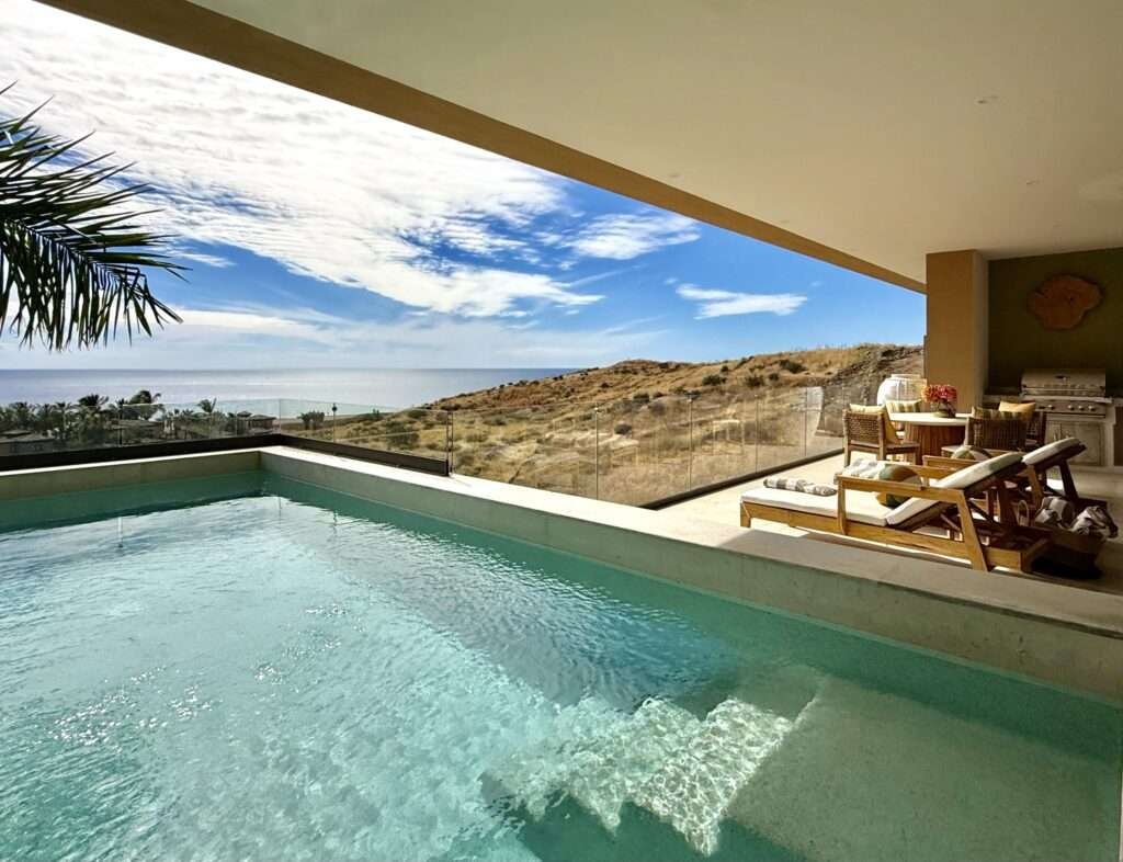 Cabo San Lucas Pedregal Csl Casa LA PIÑATA A luxury villa located in the exclusive Pedregal Cabo San Lucas. Perfect as a private residence or a high-end vacation rental, this villa offers an exceptional combination of comfort, style, privacy, and location.The villa features 8 bedrooms including a service room (as an independent apartment suite), 8.5 bathrooms, and 13 beds.Fully furnished and equipped with top-quality finishes, providing a turnkey experience.Every detail has been thoughtfully crafted to create an exceptional space for family gatherings and entertaining. The expansive terrace includes a great swimming pool, 2 jacuzzi, bar, 2 BBQ station, 2 fire pits, and multiple lounge areas, to enjoy the very best of Cabo living The interiors feature cozy and elegant living spaces, including a inside bar, games room, media room and impeccable design in every corner Fully furnished and equipped, representing an outstanding opportunity. With its exceptional design, amenities, and location, this villa embodies the best of the Baja lifestyle – Calle Paseo Colinas, Cabo San Lucas, BS