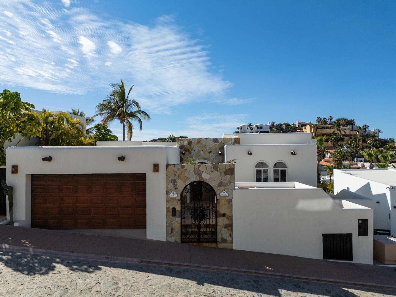 Cabo San Lucas Blue Moon La Casa Bendecida, (The Blessed House), blends luxury, comfort, and convenience. This lovingly designed villa evokes a peaceful, refined ambiance, filled with the color and vibrancy of Mexico. Situated in the private community of El Pedregal, known as the ''The Beverly Hills of Cabo San Lucas,'' this gated community offers 24 hour security, cobblestone streets, lush landscaping, a beautiful private beach, and access to the exclusive owners only Mountain Club with a restaurant, gym, tennis courts, and pickleball courts.La Casa Bendecida is inspired by Mexico's rich traditions and craftsmanship, including Talavera tile, Palo de Arco wood, brick ceiling arches, and colorful folk art. A magnificent art collection enhances the villa's spaces. The layout maximizes indoor-outdoor living with numerous lovely areas to gather, including scenic outdoor terraces and portals. Windows frame postcard-worthy glimpses of the Sea of Cortez and the Pacific Ocean, with gorgeous sunrises and sunsets. The flowing open concept of this villa connects the spacious main living room, the well-equipped kitchen, and the dining room. Each of the four bedrooms offer unique themed design, decor and vibrant artistic touches paying homage to Mexican art, folklore, and local natural landscapes. There are 3 full bathrooms and a gorgeous talavera tiled outdoor shower. Outdoor living features a hot tub, swiimming pool, a Bar-height Fire Pit Dining Table, tables and chairs for relaxation around the pool, a dining table that seats 8 and several lovely portals with talavera tiled steps. There is even a swing for two to enjoy the breathtaking sunsets over the Pacific.La Casa Bendecida was transformed and remodeled and redesigned in 2021 by the current owners, who chose to return it to a home that reflected all that they love about Mexico. It is offered completely turnkey for a buyer seeking a fully furnished, income producing property. Everything needed to continue on with this proven rental performance home is provided for you. Overlooking the gorgeous park setting of the Valley of the Blue Moon, La Casa Bendecida is a seven minute walk to the beach. The recently updated Blue Moon Park common area offers exercise equipment and walking paths.Additional features include fiber optic WiFi, HD Smart TVs, mini split air conditioning, ceiling fans in every room, an Alexa sound system, a whole house water purification system, 2 sets of washer dryers, and a large full garage with lots of storage areas.La Casa Bendecida welcomes you with open arms as you make cherished memories here that will last a lifetime.Notes:This home has been completely renovated twice in the past 10 for sale