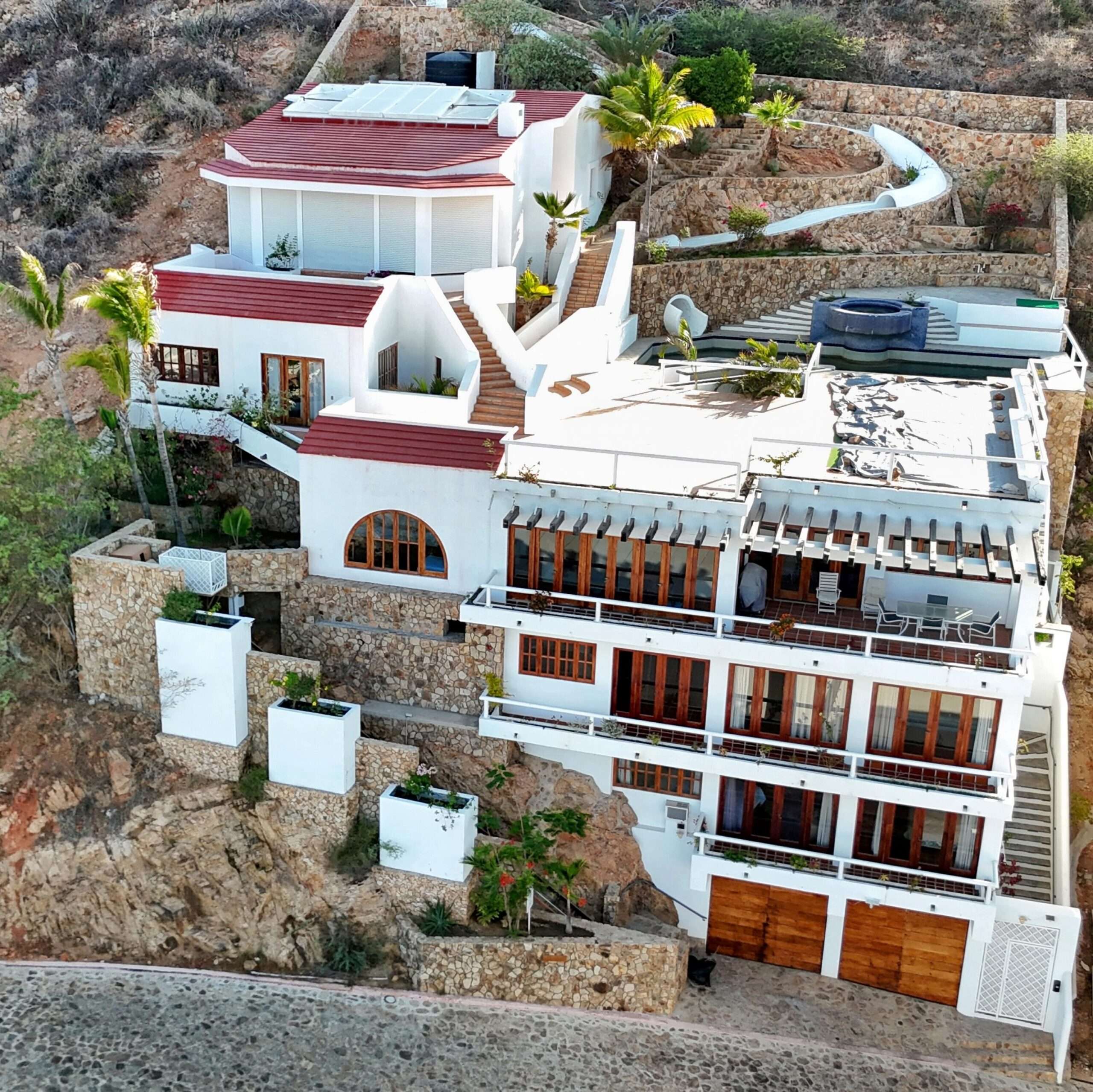 Cabo San Lucas Pedregal Csl Perched high above the marina and the Sea of Cortez, this extraordinary 10,000-square-foot estate is one of Pedregal's most iconic residences. Carved into the granite hillside, the property represents a remarkable piece of Cabo San Lucas history and offers an architectural experience unlike any other in Los Cabos.Panoramic – 115 Cam. Grande, Cabo San Lucas, BS